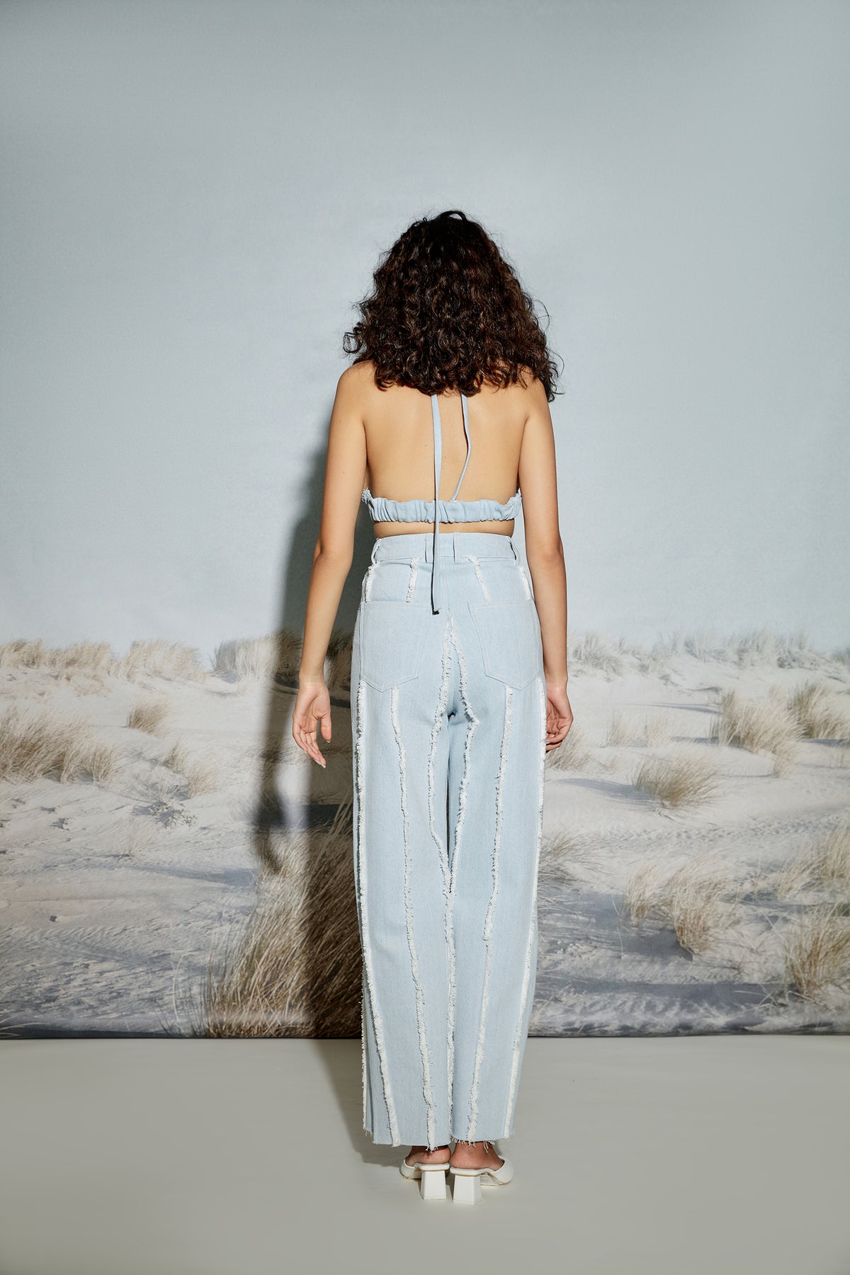 Paneled Denim Jeans with Raw Seams and Side Slit