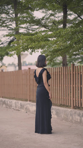 Emily in Paris: Black Ruffled High-Slit Maxi Dress